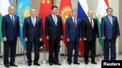 Given China's burgeoning presence in Uzbekistan, Uzbek President Islam Karimov (first from left) and his Chinese counterpart Xi JInping (third from left) probably had plenty to talk about on the sidelines of this week's Shanghai Cooperation Organization summit of regional leaders. 