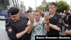 Aleksei Navalny is detained yet again by police in Moscow.