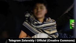 A screen grab from a video published on the Telegram account of Ukrainian President Volodymyr Zelenskiy. According to Kyiv, two North Korean soldiers were captured by Ukrainian soldiers in Russia's Kursk region.