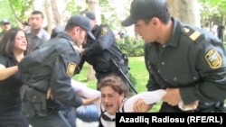Police detain a protester during the unsanctioned demonstration on May 21.