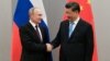 Chinese leader Xi Jinping (right, with Russian President Vladimir Putin) called the U.S.S.R.'s dissolution “a profound lesson” that many China watchers say has helped fuel Beijing’s tough crackdowns and desire for control over varying aspects of life.