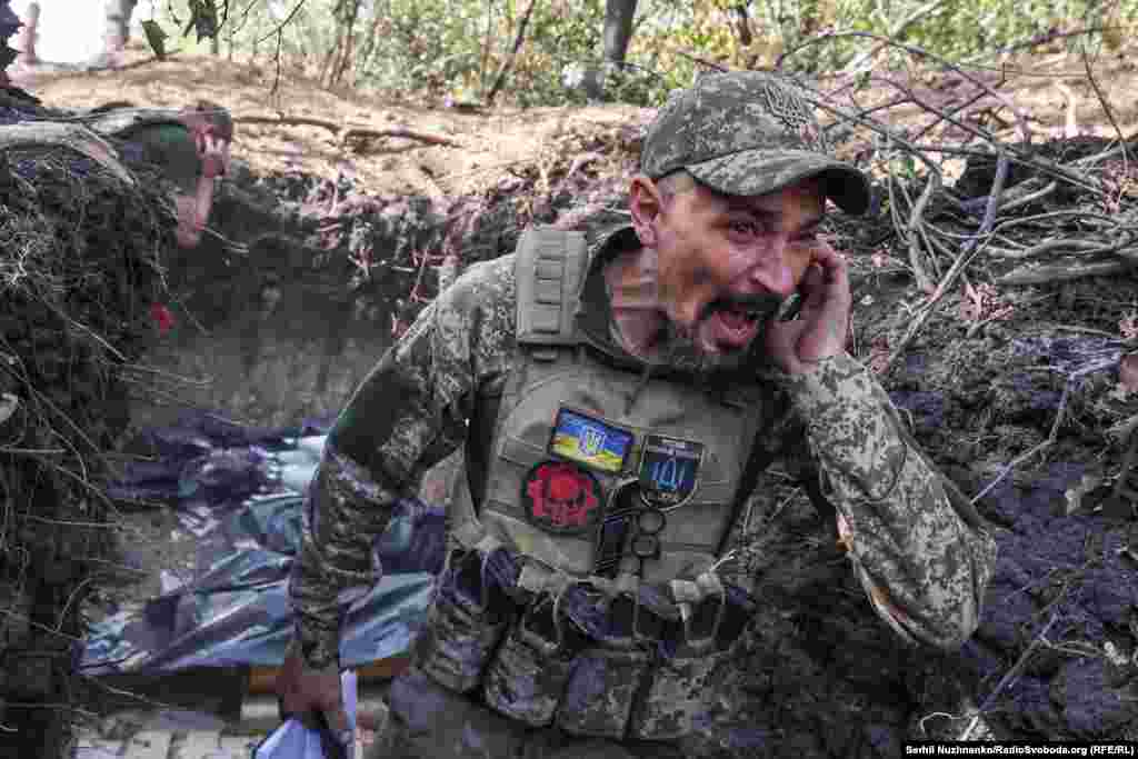 Artem, a 40-year-old Ukrainian commander, shouts a warning before his artillery team fires toward Russian positions near Pokrovsk in early October. &nbsp;