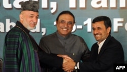 Pakistani President Asif Ali Zardari is flanked by his Afghan and Iranian counterparts, Hamid Karzai (left) and Mahmud Ahmadinejad, after a joint press conference in Islamabad in February.