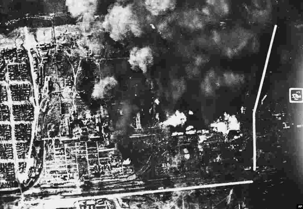 Clouds of smoke rise from besieged Stalingrad in this aerial picture that reached London and the United States via "neutral sources." Despite repeated German bombings like this, the Russian city was still holding out. (White markings on the photo are not explained.) (AP)