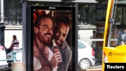 An advertisement promoting gay acceptance, which prompted a political backlash, is seen in Budapest in August 2019. 