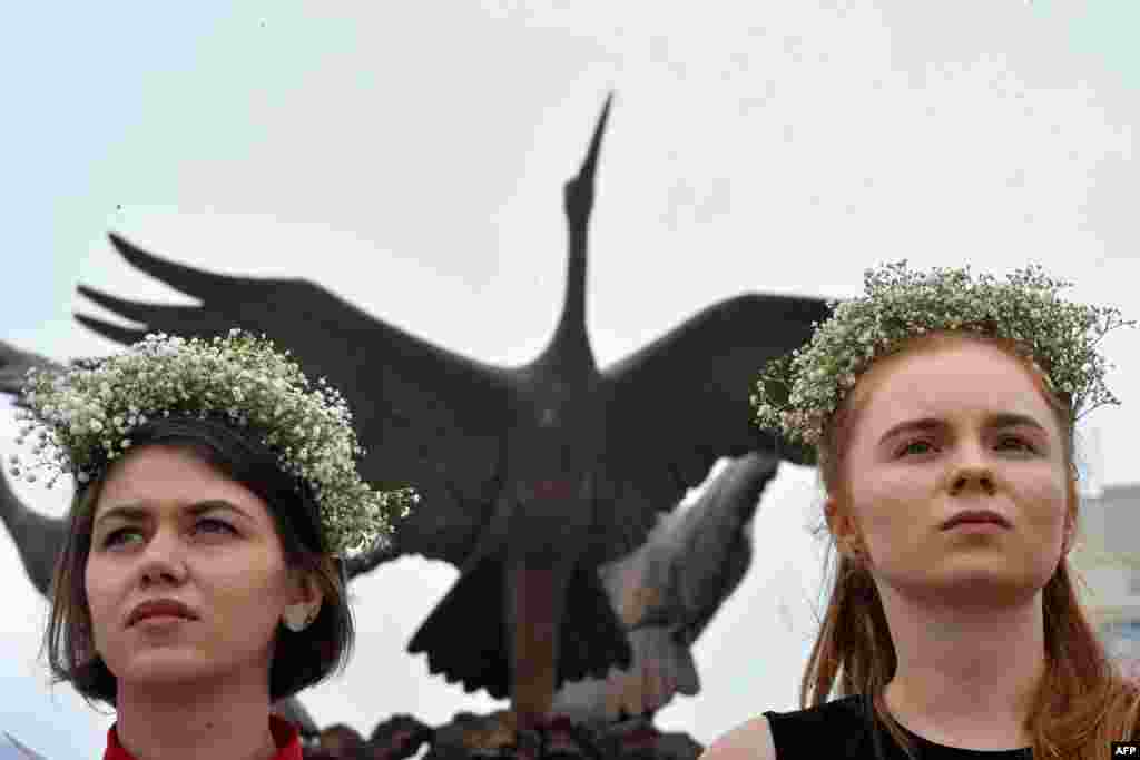 Two women in traditional headgear take part in the protest on Independence Square. 