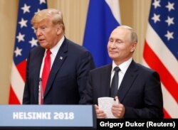 U.S. President Donald Trump with his Russian counterpart, Vladimir Putin, arrive for a joint news conference after their meeting in Helsinki in July 2016.