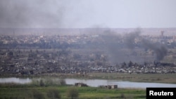 نمایی از روستای باغوز در جنوب سوریه که نیروهای دموکراتیک سوریه می گویند آخرین بازمانده‌های گروه داعش در سوریه را در نبرد در این منطقه شکست داده‌اند