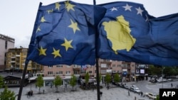 The EU and Kosovar flags in the main square of Pristina