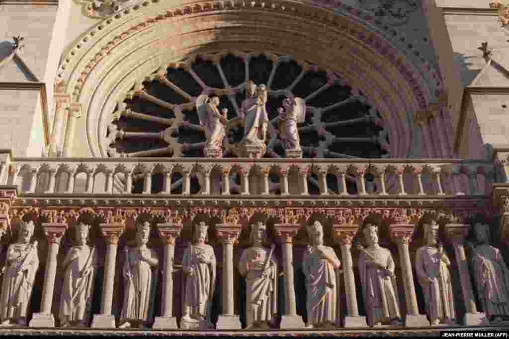 One of the three stained glass "Rose Windows" is seen after the restoration of the cathedral's facade in 1999. 