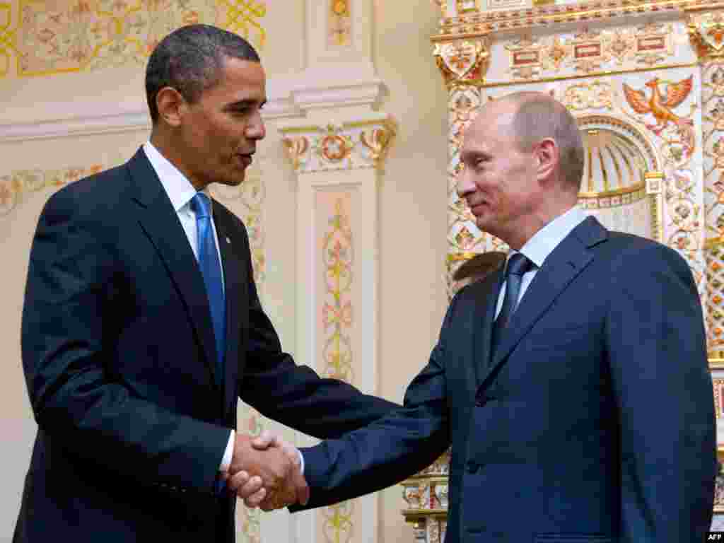 U.S. President Barack Obama and Russian Prime Minister Vladimir Putin shake hands during a meeting at the latter's country residence home in Novo Ogaryovo, near Moscow, in July 2009.