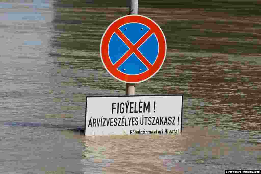 A sign near the Danube River in the Hungarian capital that reads: "Attention! Flood-prone road"