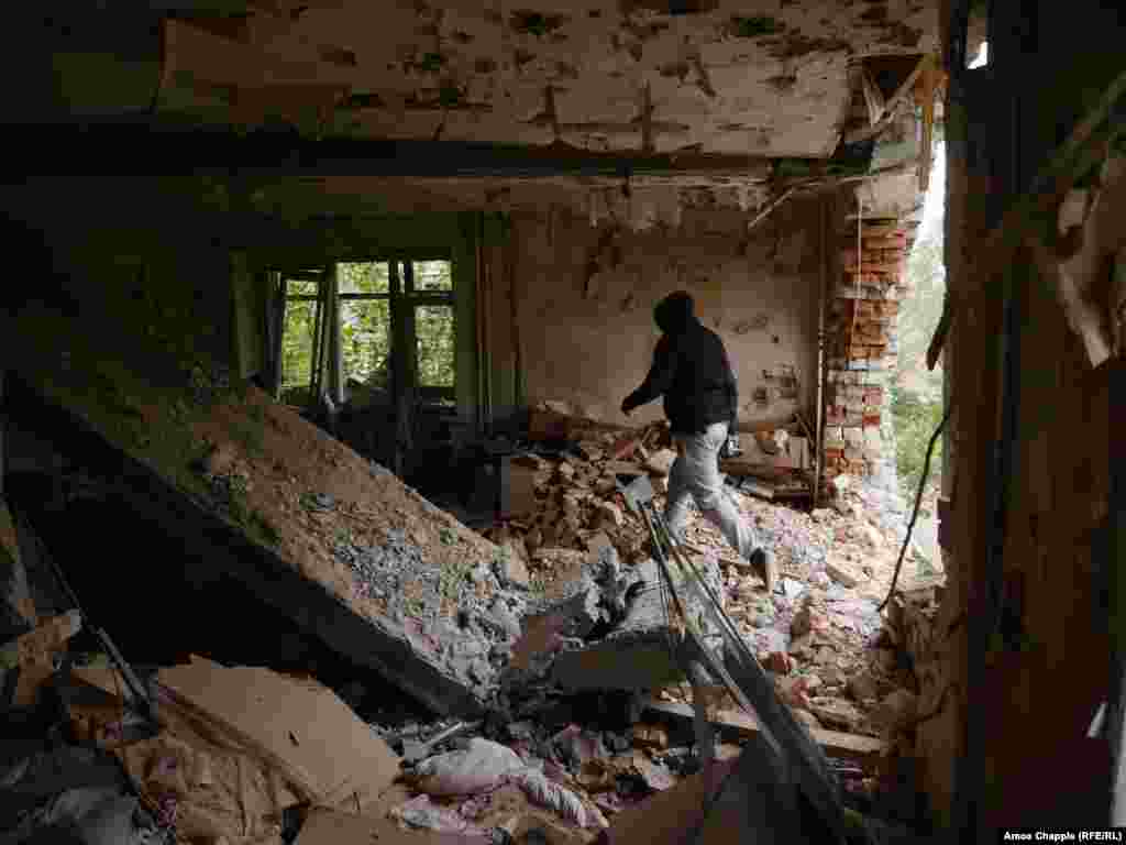 A neighboring apartment block that took a direct hit from a Grad (Hail) rocket in 2014. 
