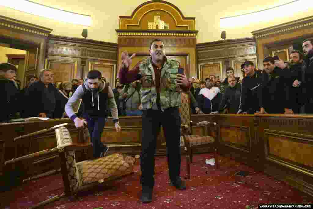 Protesters inside the partially-vandalized government building in central Yerevan. 