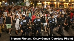 Romanians took to the streets in Bucharest for the third night of antigovernment protests on August 12. 