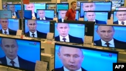 Russian President Vladimir Putin awarded the journalists for their "high-level professionalism" and "objective coverage of events in Crimea" as Russian forces took control of the Ukrainian peninsula.