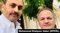 Afghan writer and researcher Najib Mayel Heravi (right) with his son Shahab Heravi. (file photo)