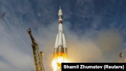 The Soyuz MS-09 spacecraft blasts off carrying the crew of Serena Aunon-Chancellor of the U.S, Alexander Gerst of Germany, and Sergei Prokopyev of Russia.