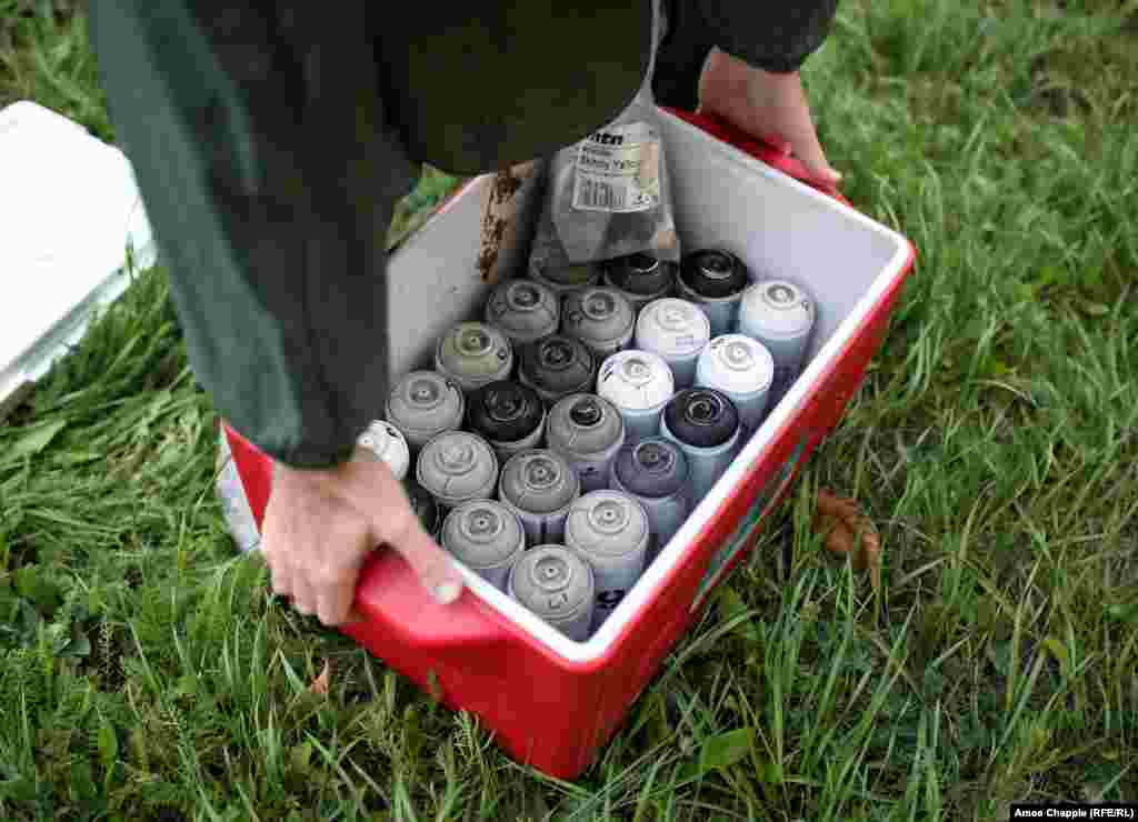 Twenty-four shades of gray which are used for the mural. Van Helten says "there is this idea that art is this valuable thing and money has to be spent on it, but for projects like this I'm not charging anything, it's just my time." Geo Leros, from Art United Us, says that the paint, travel, and rental of the lift was paid for by private sponsors. 