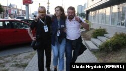 Nasha Niva journalist Natallya Lubneuskaya (center) was shot in the leg while covering protests on August 10.