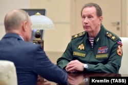 Russian President Vladimir Putin (left) with the chief of the National Guard, Viktor Zolotov (file photo)
