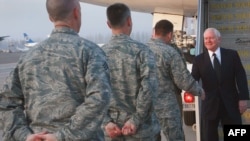 U.S. Defense Secretary Robert Gates meets with U.S. Air Force officials at Manas Air Base in Kyrgyzstan last month.
