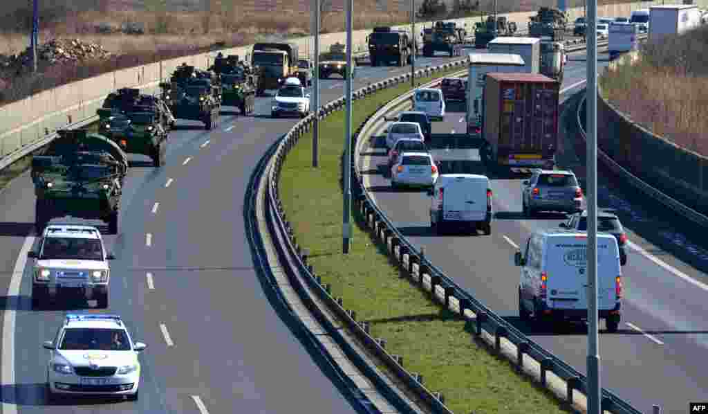 The military convoy rides into Prague.