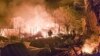 Ukrainian emergency workers deal with the aftermath of a Russian drone strike on Kharkiv late on April 29.