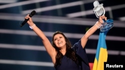 Ukraine's Jamala reacts upon winning the Eurovision Song Contest in Stockholm. Critics say her song about the deportation of Crimean Tatars in the 1940s should not have been allowed compete in this year's contest as it was too overtly political, which is against competition rules. 