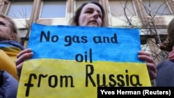 A demonstrator outside the German Embassy in Brussels on March 11.