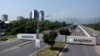 Containers block roads to Islamabad as Pakistani security forces attempt to impede protesters on October 5.