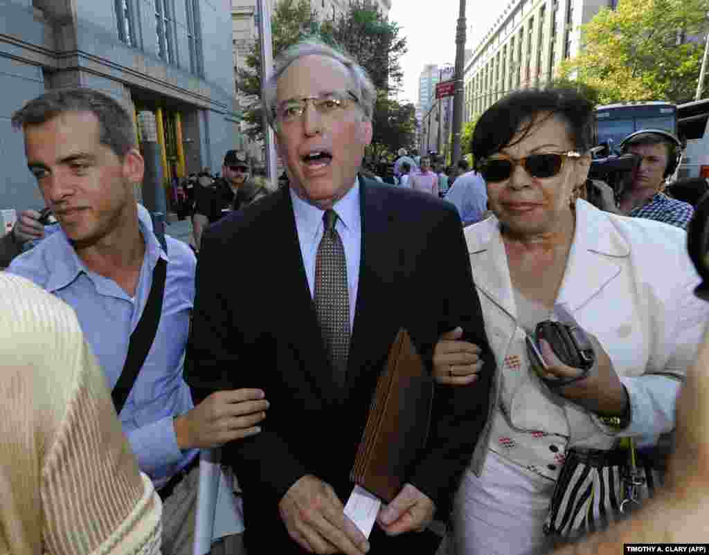 Robert Baum (center), Chapman&#39;s lawyer, talks to the press outside Manhattan Federal Court in New York on July 8, 2010, after she pleaded guilty to charges that she communicated with the Russian Federation without registering as a foreign agent.