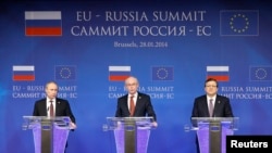Russian President Vladimir Putin (left to right), European Council President Herman Van Rompuy, and European Commission President Jose Manuel Barroso address a joint news conference in Brussels on January 28.