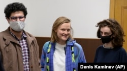 Doxa editors Armen Aramyan (from left), Natalya Tyshkevich, and Alla Gutnikova await the court session in Moscow on April 14.
