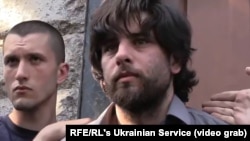 A screen grab of Rafael Lusvarghi being apprehended by a mob of Ukrainian nationalists on May 4.