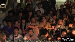 Maksat Aimakhanov is identifiied in this YouTube video grab with a red circle.