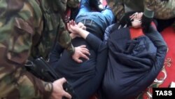 A photo released by the public relations center of the Russian security services showing the arrest of alleged Islamic State extremists in Daghestan. (file image)