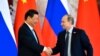 Putin, Xi Play Up Relations