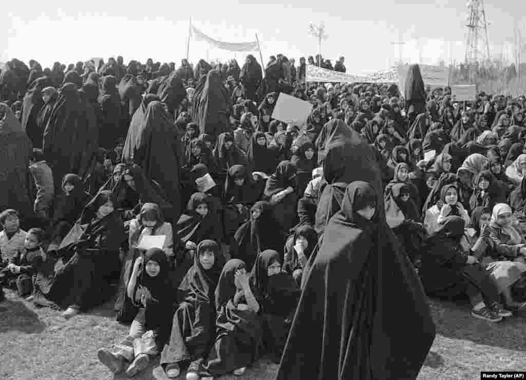 Tens of thousands of Iranian women gather in Tehran on March 16, 1979, to support Ayatollah Khomeini's call for women to adhere to Islamic laws. This included the wearing of a long black garment, the chador.