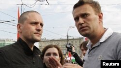 Udaltsov (left) and anticorruption activist Aleksei Navalny speak during the Bolotnaya protest in Moscow on May 6, 2012.