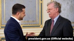 Ukrainian President Volodymyr Zelensky (left) and U.S. national-security adviser John Bolton in Kyiv on August 28. 