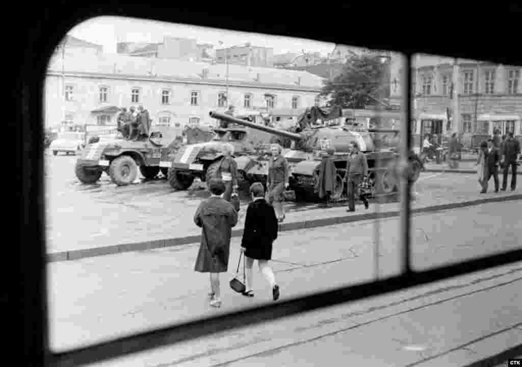 Soviet tanks and armored vehicles guard an area of Republic Square in downtown Prague.