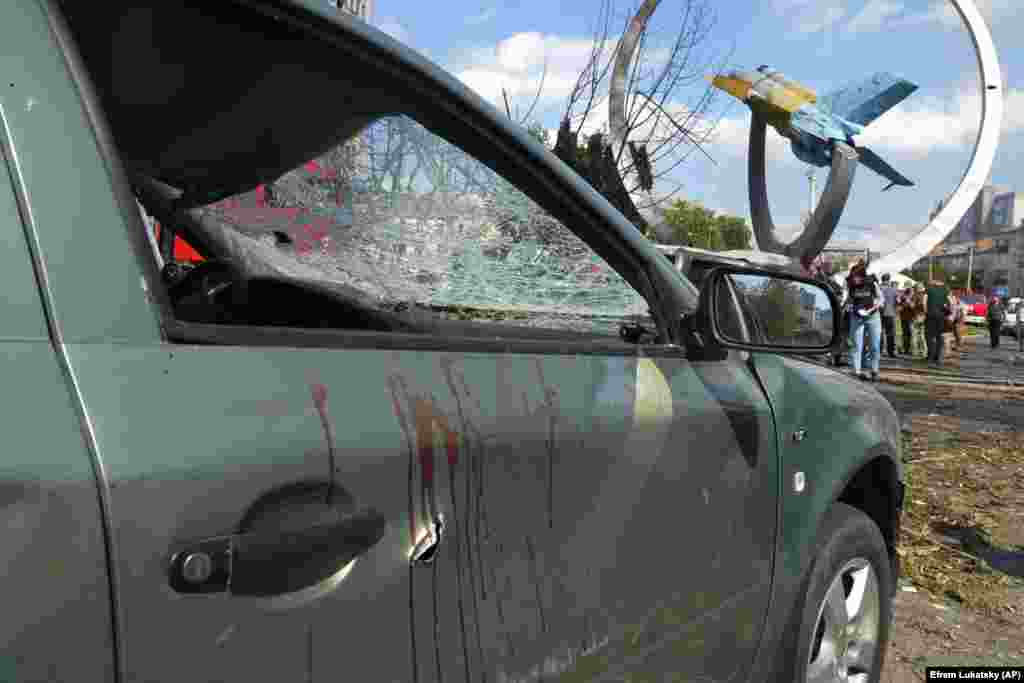 Blood stains are seen on a damaged car. Ukrainian President Volodymyr Zelenskiy condemned the attack as “an open act of terrorism."