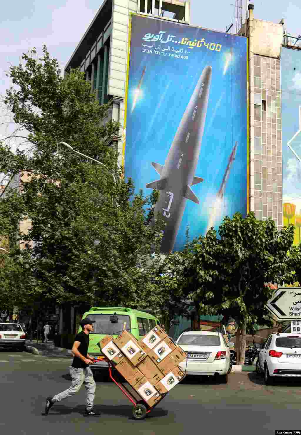 A poster in Tehran shows a larger missile from the same family as the Fath-360. Tehran has denied reports its missiles are being supplied to Russia but a senior Iranian lawmaker appeared to contradict the official line. On September 7, Ahmad Bakhshayesh Ardestani told Iranian media, "We have to barter for our needs, including importing soybeans and wheat. Part of the barter involves sending missiles, and another part involves sending military drones to Russia." 