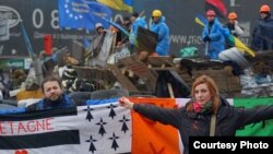 Dimitri Halby and his wife, Oksana, are helping to coordinate global protests against the sale of Mistral warships to Russia. They are shown here participating in Euromaidan protests in Kyiv in February.