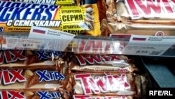 Some shops use more elaborate printouts featuring a Russian flag to identify products that have been imported from Ukraine's eastern neighbor.