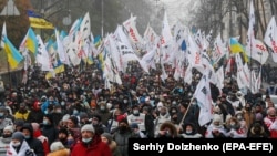 People working in the small business sector march during a rally demanding support for individual entrepreneurs in Kyiv on December 4.