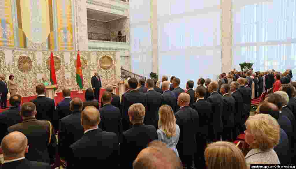 Lukashenka was sworn in for a sixth term in front of several senior officials. He put his right hand on the constitution and took the oath of office, before signing it.