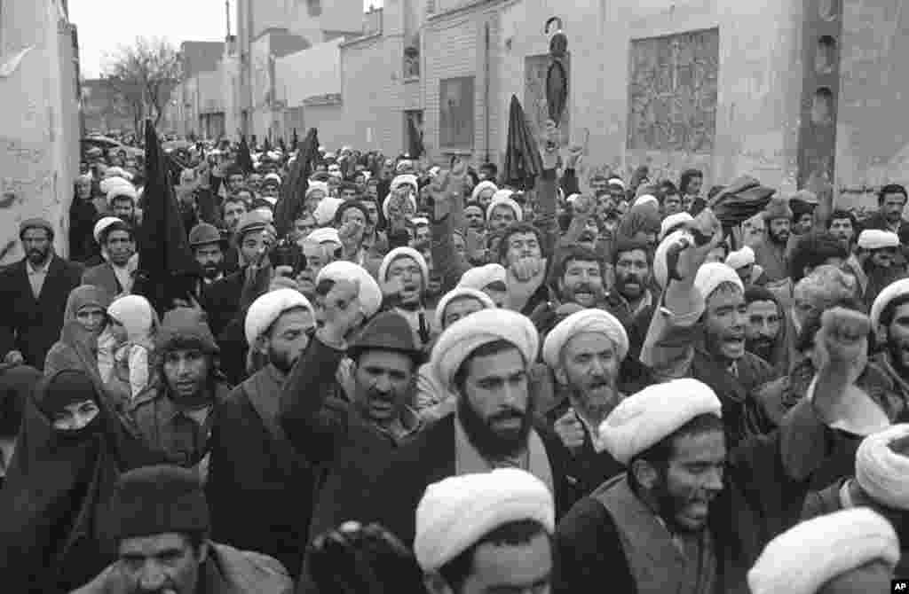 Mullahs march past Ayatollah Khomeini's house in Qom on December 17, 1979 in display of solidarity with the Iranian leader. Khomeini became Iran's Supreme Leader that month.