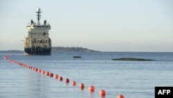 A ship lays the now-damaged telecommunications cable off the shore of Helsinki in October 2015.